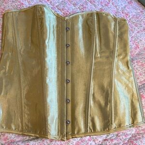 New unworn gold bustier